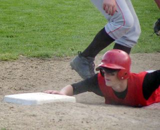 Sam Forsmann beats a pickoff attempt at first. He had 3 hits in each game Saturday.