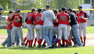 The team erupted out of the dugout after Eric Daly's catch to celebrate on the field.