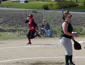 Kara Guyer rounds third as she hit a 2-run homer to the right field corner.