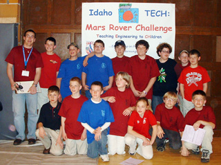 The Prairie Middle School Mars Rover teams with PHS grad Kelby Wilson, who was one of the judges.