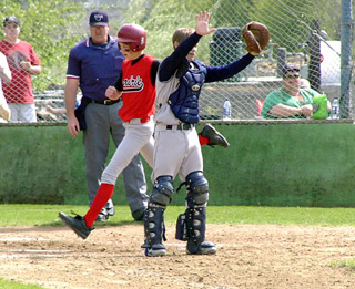 Nate Kaschmitter scores the go-ahead and eventual winning run on a single by Mat Forsmann.