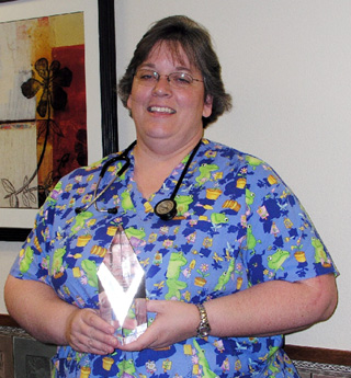 Shari Kuther with her award.