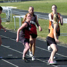 Tabitha Sonnen has just handed to Kayla Lorentz in the 4x400 relay.