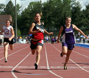 Nicole Nida wins the 100 for her first of 3 state titles.