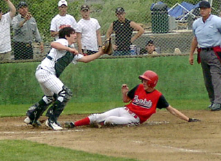 C.J. Rieman slides home with a run in Friday's game.