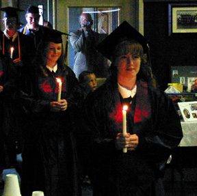 Jeannie Goeckner leads a candlelit processional.