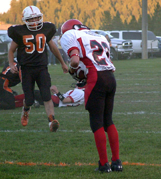 Jake Holthaus looks down to make sure he's in the end zone after catching a pass for a 2-point conversion.