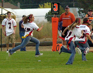 Kristi Poxleitner makes a big gain for the Junior-Sophomore team.