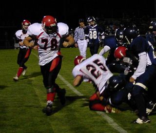 J.D. Riener, 78, looks back as Danny Riener crosses the goal line.