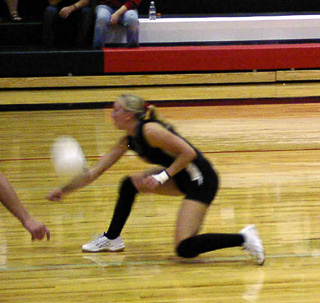 Tabitha Sonnen races in to dig up a serve.