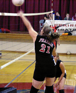 Charlene Duman, who normally hits right-handed, scores a kill left-handed against C.V. Behind Charlene is Carolyn Sonnen.