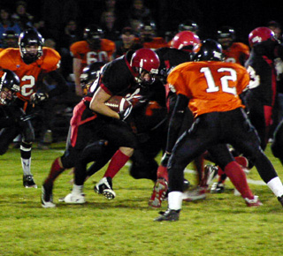 Ryan Daly runs for yardage on the first play of the game.
