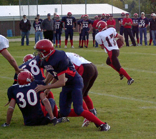 Kyle Holthaus carries the other way as the Eagles defense is tied up by Prairie blockers.