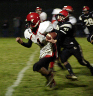 David Sigler gains yardage for a first down on a pass play.