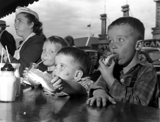 Three boys eating hot dogs at the Minnesota State Fair, 1947