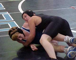 Garrett Schmidt tries to turn his opponent for a possible pin.