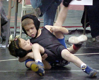 Devin Ross appears to be getting close to a pin of his opponent.