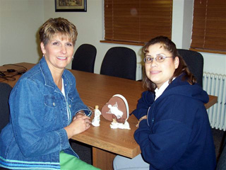 Cheri Holthaus and Collette Schaeffer with some of the ornaments for this year's Angel Tree.