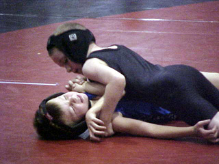 Hunter Chaffee is about to pin his opponent.