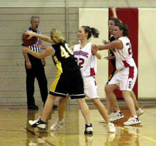 Randi Schumacher and Becky Gehring defend against Timberline.