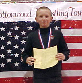 Drew Cochran on the medal stand after receiving his first place award.