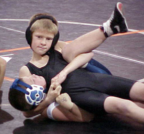 Tannor Ross has the cradle locked in and appears ready to pin his opponent.