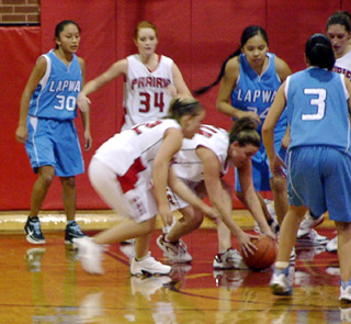 Becky Gehring dives on a loose ball as Meghan VanderPas also goes after it. In back is Sarah Arnzen.