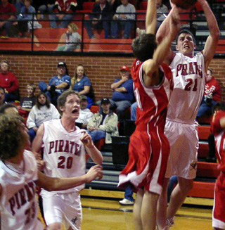 Corey Schaeffer shoots as David Sigler and Tyler Forsmann look on.
