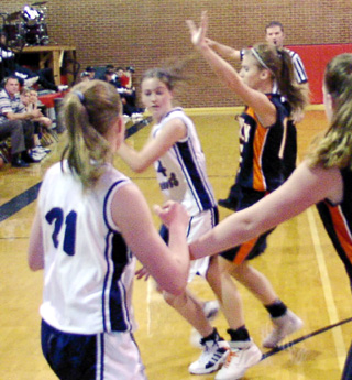 Jacquie Lustig tries to pass as Alyssa Frei looks on.