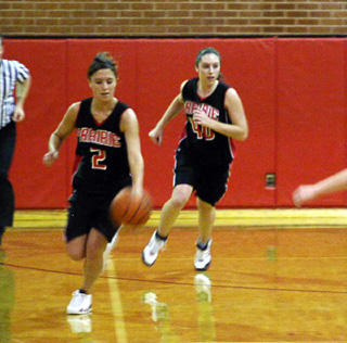 Kaylee Uhlenkott and Nicole Nida head upcourt after a Council turnover.