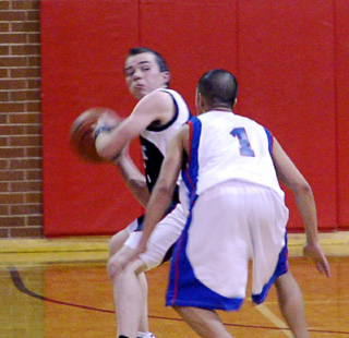 Zach Frei tosses a pass downcourt in Summit's game against Sitka.