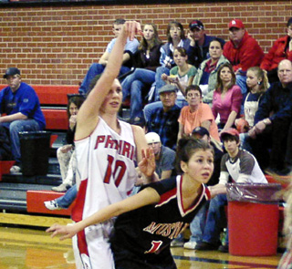 Tiffany Schaeffer holds her follow-through as she watches her 3-point shot go in.