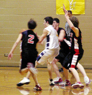 The Prairie defenders surrounds a Timberline player.