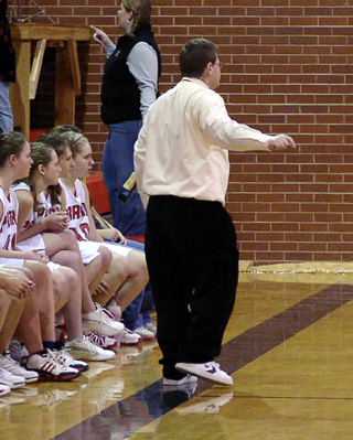 Head coach Steve White Shoes Wilson forgot his dress shoes at the girls game against Timberline last Friday.