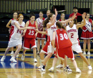 Nicole Nida and Tiffany Schaeffer double team the ballhandler against CV. At left is Sarah Arnzen.