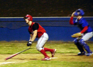 Dan Riener watches the ball head for the fence as he homers against Orofino.