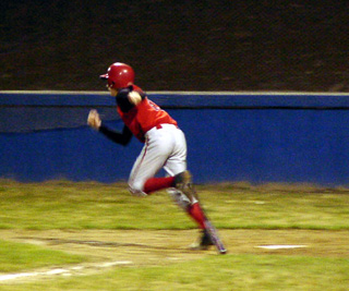 David Sigler heads for first on his way to an infield single.
