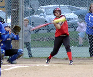 Brooke Holthaus takes a swing at a high pitch.