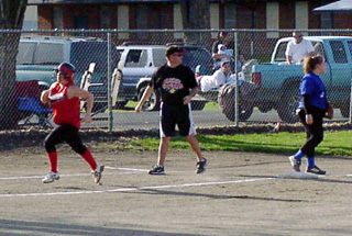 Meghan VanderPas heads for home on the first of her 2 second inning homers.