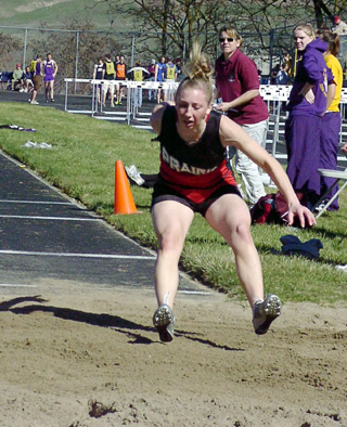 Tabitha Sonnen lands in the triple jump pit. She finished 4th in the event.