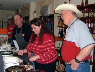 Lyle Kuther, Danette Horrocks (serving sausage from Phils Grocery in Kendrick) and Phil Remacle served up their creations at last years Schmeckfest.
