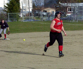 Hilaree VanderPas heads for third with a triple, one of just 2 hits against Lewis County.