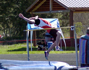 Jake Holthaus attempts to clear a height in the high jump.