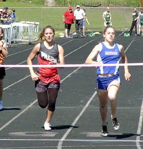 Nicole Nida finishes second in the 100 to Orofino's Ellen Rouse.