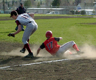 Kyle Holthaus is afe at third.