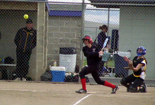 Alli Holthaus connects for a hit against Timberline.