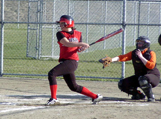 Brooke Holthaus smashes one for a triple against Kendrick.