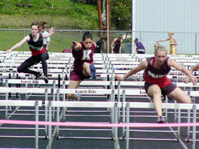 NaTosha Schaeffer, left, and Tabitha Sonnen during a heat of the 100 hurdles.