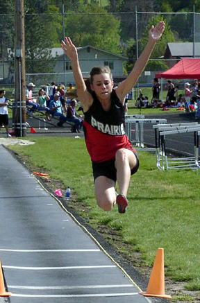 Gina Holthaus gets som height in the long jump.