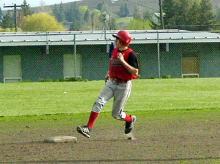 Kyle Daly pulls into second with a double against Lewis County.